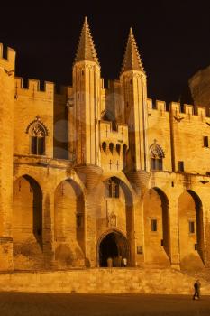 
Middle-aged pope's palace in Avignon at night
