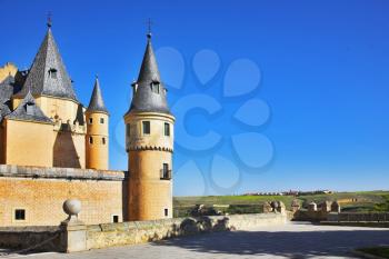 Ancient picturesque palace of the Spanish kings in Segovia and rural fields
