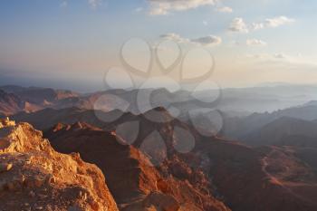 Classical bible landscape - desert Sinai in a morning fog and Red sea 