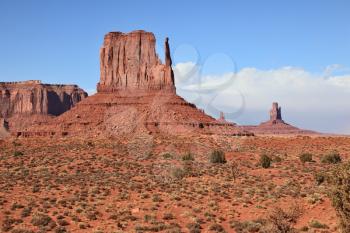 World-wide well-known Mittens from red sandstone. Red Desert. Monument Valley - Navajo Reservation during the summer thunderstorms.