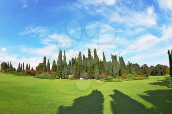 The most romantic landscape park garden in Italy.  The shadows of the cypresses slender gently fall on the green meadows