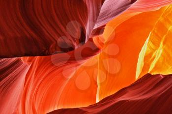 Midday in red-orange Antelope Canyon. The Play of light, colors and shades gives rise to picturesque pictures
