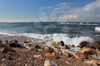 Sea surf after the big winter storm. Stony coast Mediterranean sea, Israel