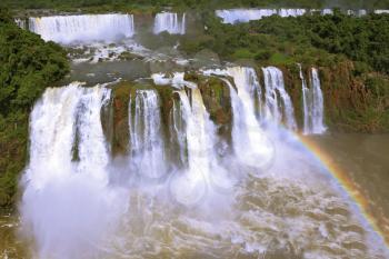 The best-known falls in the world - Iguazu. The magnificent rainbow costs over roaring water streams. Brazilian party.