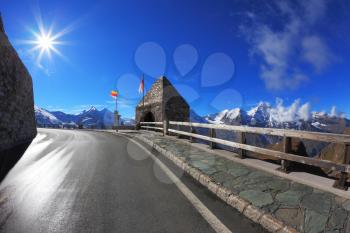  Bright sunny day. Picturesque alpine road Grossglocknershtrasse. Photo taken by lens Fisheye