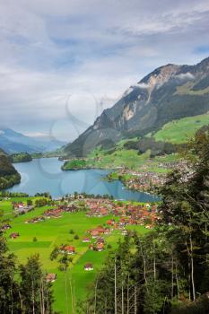  A valley in Switzerland, lake and settlement