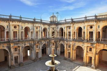 Beautifully preserved castle - palace of the Templars. Courtyard surrounded by galleries. In the center - a fountain. Portugal, Tomar