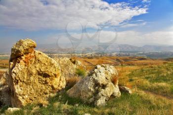  Huge stones in  grass in the Jordanian valley