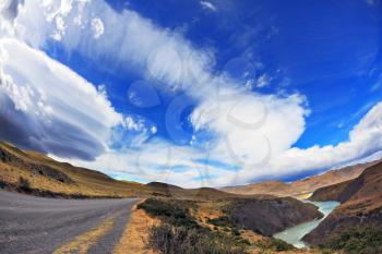 Journey into a far country. The gravel road on the bank of the river and the incredible ice clouds form. The picture was taken Fisheye lens