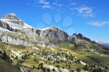 Swiss Alps in early fall. Cold sharp rocks slightly sprinkled with the first snow
