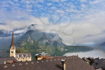 The most picturesque small town in Austria - Hallstatt. Slender bell tower and the church on the shore of Lake Hallstatt