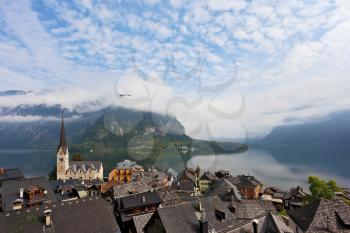 The most picturesque small town in Austria - Hallstatt. Slender bell tower and the church on the shore of Lake Hallstatt