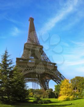 Park at the foot of the Eiffel Tower. Travel Paris. Unexpected angle Fisheye lens takes