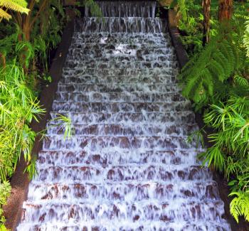 Picturesque cascading waterfall in a tropical park