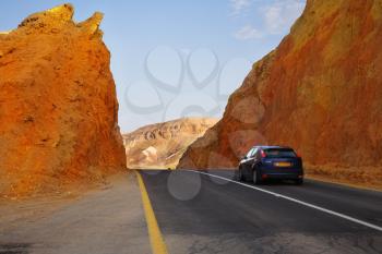 The beautiful car on highway in stone desert at Red sea