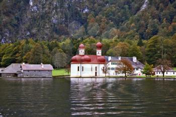 Famous church St. Barths with red domes on the shore Koenigssee