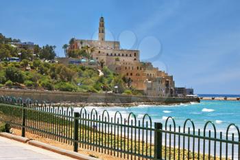 Ancient and modern port of Jaffa in Israel. The seafront fenced openwork low fence