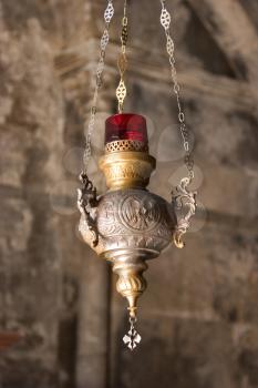  The metal lamp suspended on three circuits to a ceiling of church in Jerusalem