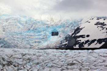  Blue ice covered ground black volcanic ash. The southern part of the huge Vatnajokull glacier. Skaftafell National Park