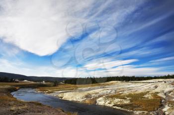 Flying clouds above meadows, woods  and river of the most well-known park in the world Yellowstone national park