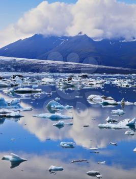 South-east Iceland in July. Transparent icebergs and ice floes in the Ice Lagoon Jokulsarlon