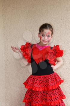 Lovely slim girl with a spectacular make-up dancing flamenco