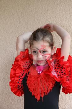 Lovely slim girl with a spectacular make-up dancing flamenco
