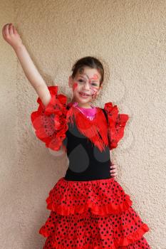 Lovely slim girl in a red-black dress flamenco dancers