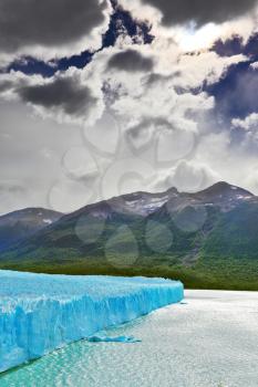 Colossal Perito Moreno glacier in Lake Argentino. Los Glaciares National Park in Argentina. Sunny and windy summer day