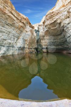 Clean cold water in the creek canyon. Sandstone walls apart, like butterfly wings. Picturesque canyon En-Avdat in the Negev desert