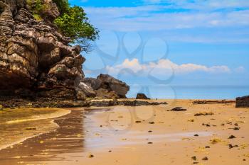 Unique Andaman Sea. Rocks of the island in the shallow waters and beautiful beaches with fine  sand