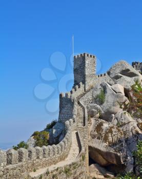 Fabulously beautiful Moorish castle in Portugal - the ancient stone walls and guard towers gear. The resort of Sintra, the Atlantic coast