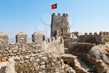 Fantastically beautiful moorish fortress in Portugal - ancient stone walls and gear watchtowers. Resort Sintra, coast of Atlantic ocean
