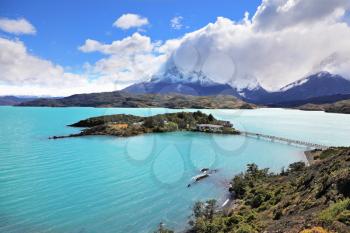 National Park Chile - Torres del Paine. Island Lake Pehoe and comfortable hotel. Easy bridge connects the hotel and the beach