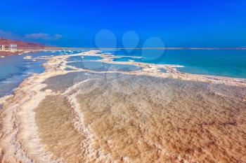 Dead Sea off the coast of Israel. Vaporized salt form whimsical patterns on the water surface 
