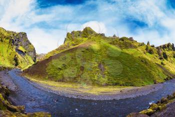 Scenic summer Iceland. The photo was taken Fisheye lens. The canyon Pakgil fast flowing shallow stream