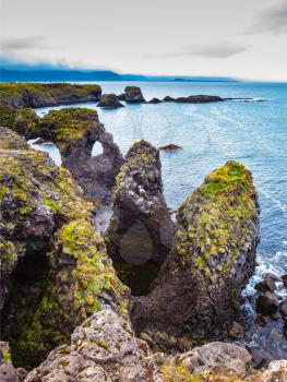 The fantastic coastal cliffs Arnastapi. Travel to Iceland in the summer