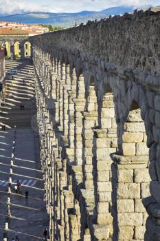 The well-known antique aqueduct and ancient Segovia in spring day
