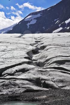 Enormous glacier in mountains of Northern Canada. Thawing edges