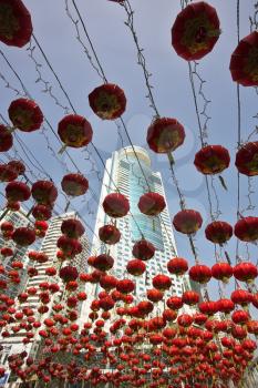 Traditional red lanterns and the modern skyscrapers decorating the Chinese city in New year