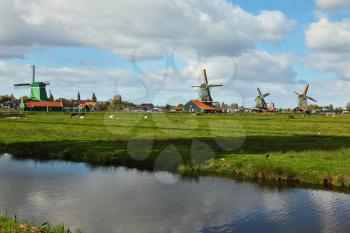 Windmills in museum village in Holland. Good autumn day