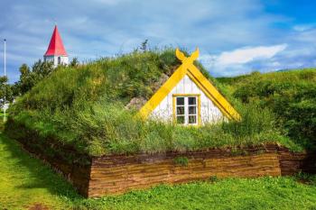 Village of ancestors. The recreated village -  museum of first settlers in Iceland. Houses are roofed by the turf and grass