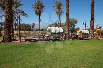 The open air museum. Restored antique wagons of the first settlers in the oasis in Death Valley
