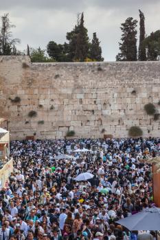 The area in front of the Western Wall of the Temple filled with people. The Jewish holiday of Sukkot,  Jerusalem