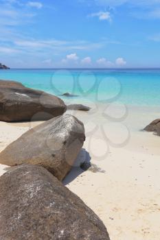 Similan Islands, Andaman Sea, Thailand.
 Finest white sand beach adjacent to the great brown cliffs and azure water. Unusual beach