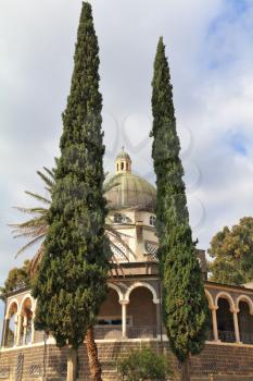 Basilica on Mount of Beatitudes. Israel, lake Tiberias. The majestic dome and gallery with columns are surrounded by cypresses