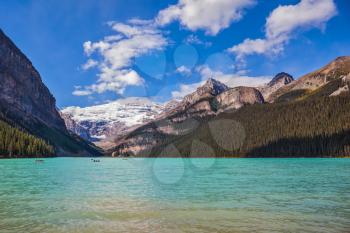 Banff National Park, Canada, Alberta. Magnificent Lake Louise with emerald water surrounded by the Rocky Mountains and glaciers
