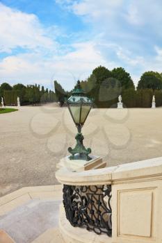  White marble staircase and antique bronze lantern. Schönbrunn - the summer residence of the Austrian Habsburg emperors.