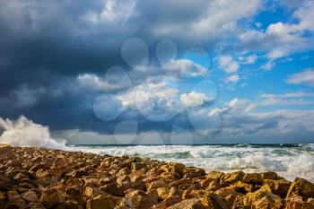 New Quay in the Old Jaffa in a winter storm. Huge foaming waves of the Mediterranean beat against the shore. Tel Aviv in January