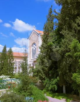 The famous Trappist monastery - Latrun. Israel. The magnificent building of the temple is surrounded by a lush garden